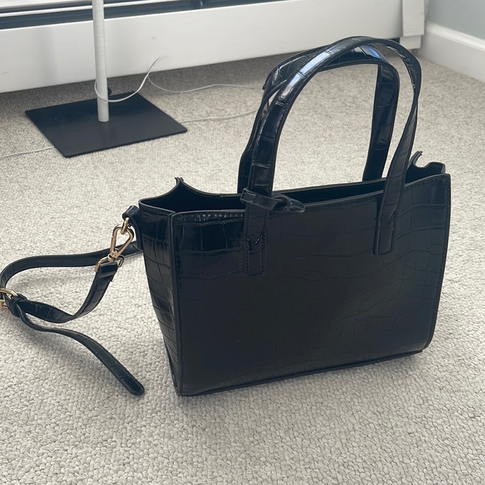 Black purse with adjustable strap
